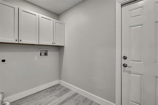 4360 Talco Ave, Spring Hill, FL 34609 - washroom featuring cabinet space, light wood finished floors, hookup for an electric dryer, and hookup for a washing machine