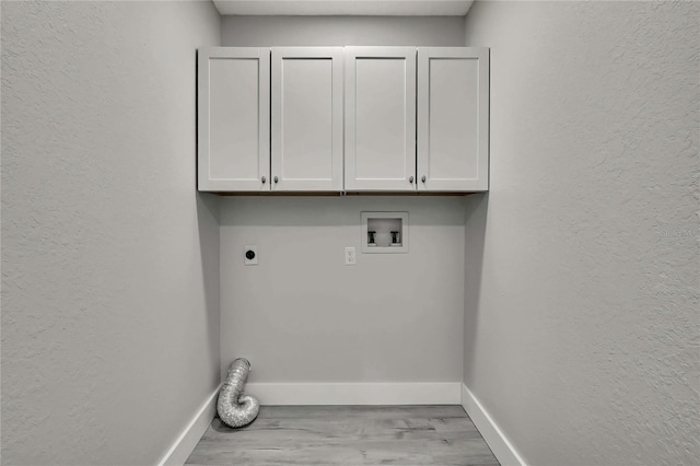 4360 Talco Ave, Spring Hill, FL 34609 - washroom with electric dryer hookup, wood finished floors, cabinet space, hookup for a washing machine, and a textured wall