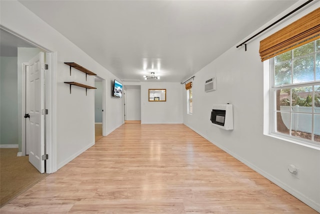 4622 Paloverde Dr, New Port Richey, FL 34652 - unfurnished living room featuring heating unit and light wood finished floors