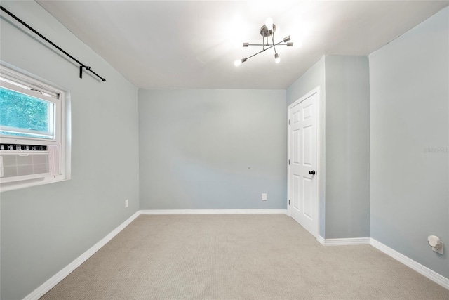 4622 Paloverde Dr, New Port Richey, FL 34652 - spare room featuring a chandelier and carpet flooring