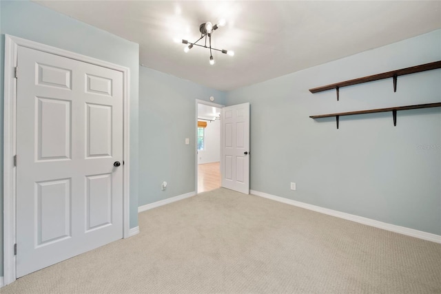 4622 Paloverde Dr, New Port Richey, FL 34652 - unfurnished bedroom featuring carpet flooring and a chandelier