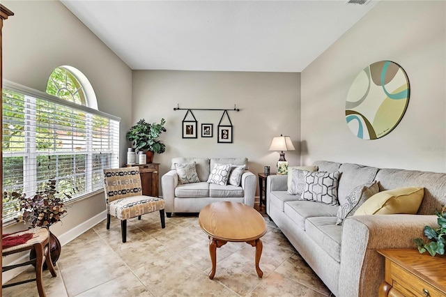 11101 Ragsdale Ct, New Port Richey, FL 34654 - living room featuring light tile patterned floors and baseboards