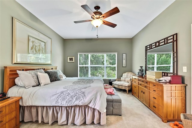 11101 Ragsdale Ct, New Port Richey, FL 34654 - bedroom with light colored carpet and ceiling fan