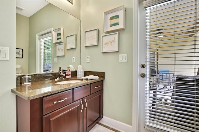 11101 Ragsdale Ct, New Port Richey, FL 34654 - bathroom featuring vanity and baseboards