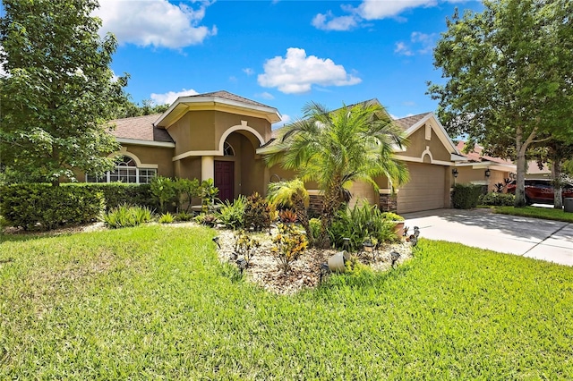 11101 Ragsdale Ct, New Port Richey, FL 34654 - mediterranean / spanish house featuring stucco siding, an attached garage, concrete driveway, and a front yard