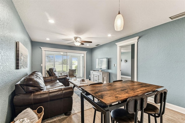 3745 Teeside Dr Unit 3745, New Port Richey, FL 34655 - living area featuring a textured wall, a ceiling fan, light wood finished floors, and recessed lighting