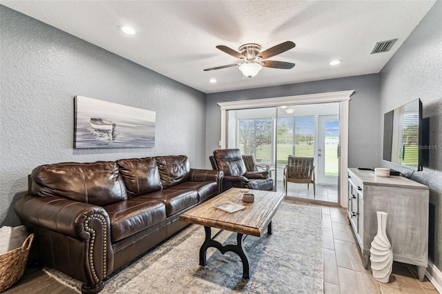 3745 Teeside Dr Unit 3745, New Port Richey, FL 34655 - living area with a textured wall, ceiling fan, a textured ceiling, light wood finished floors, and recessed lighting