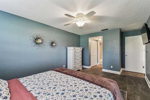 3745 Teeside Dr Unit 3745, New Port Richey, FL 34655 - bedroom featuring wood finished floors, a textured ceiling, and ceiling fan