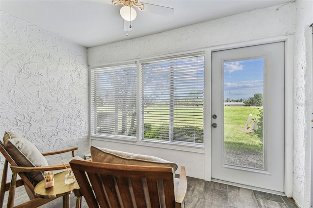 3745 Teeside Dr Unit 3745, New Port Richey, FL 34655 - living area featuring a textured wall and a ceiling fan