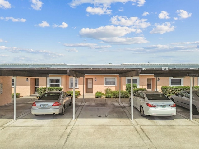 3745 Teeside Dr Unit 3745, New Port Richey, FL 34655 - townhome / multi-family property featuring stucco siding and covered parking