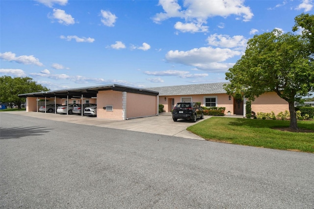 3745 Teeside Dr Unit 3745, New Port Richey, FL 34655 - view of building exterior with covered parking