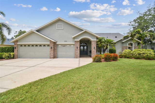 2519 Shipston Ave, New Port Richey, FL 34655 - view of front of property featuring an attached garage, a front yard, concrete driveway, and stucco siding