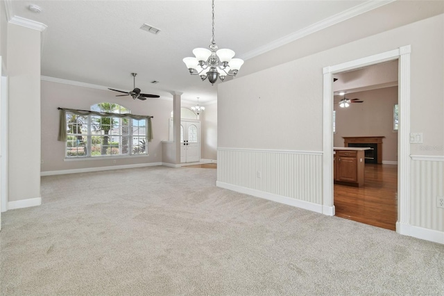 2519 Shipston Ave, New Port Richey, FL 34655 - carpeted spare room featuring ceiling fan, a chandelier, ornamental molding, and a smoke detector