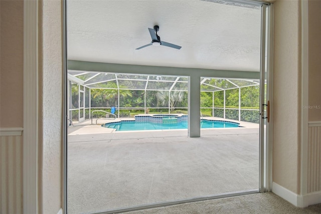 2519 Shipston Ave, New Port Richey, FL 34655 - view of pool with a patio, glass enclosure, a ceiling fan, and a pool with connected hot tub