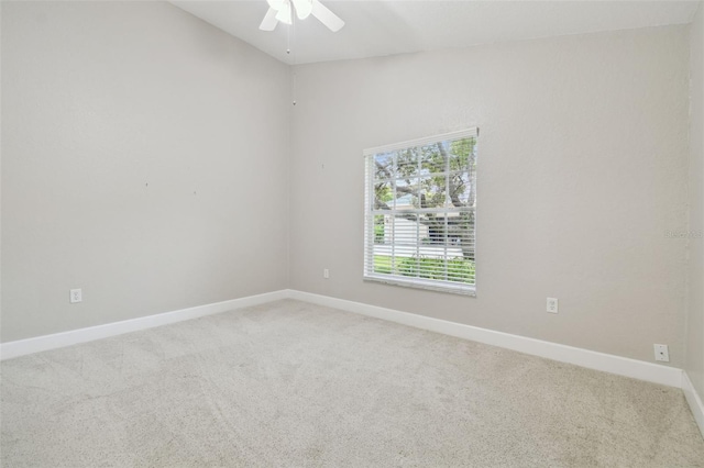 2519 Shipston Ave, New Port Richey, FL 34655 - empty room with light colored carpet, a ceiling fan, and vaulted ceiling