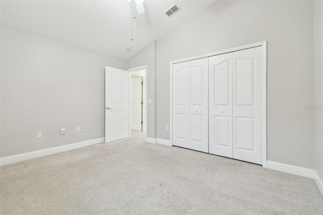 2519 Shipston Ave, New Port Richey, FL 34655 - unfurnished bedroom featuring carpet, vaulted ceiling, a closet, and ceiling fan