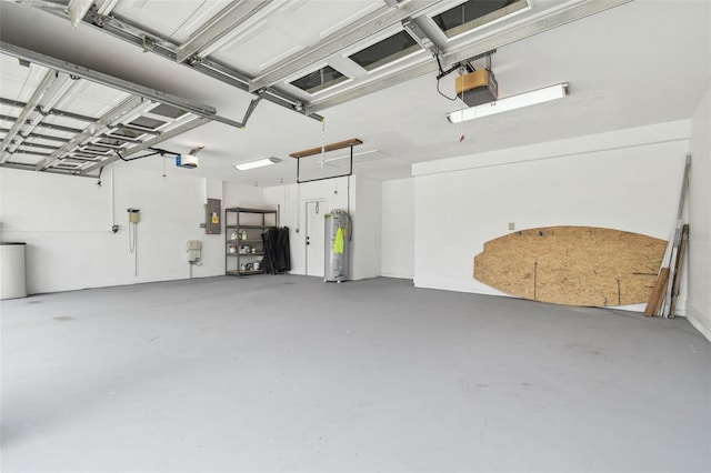 2519 Shipston Ave, New Port Richey, FL 34655 - garage featuring electric panel, water heater, and a garage door opener