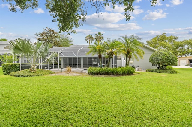 2519 Shipston Ave, New Port Richey, FL 34655 - rear view of property with a lawn, a lanai, and stucco siding