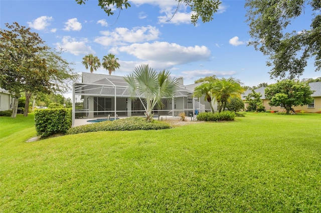 2519 Shipston Ave, New Port Richey, FL 34655 - view of green lawn with an outdoor pool and glass enclosure