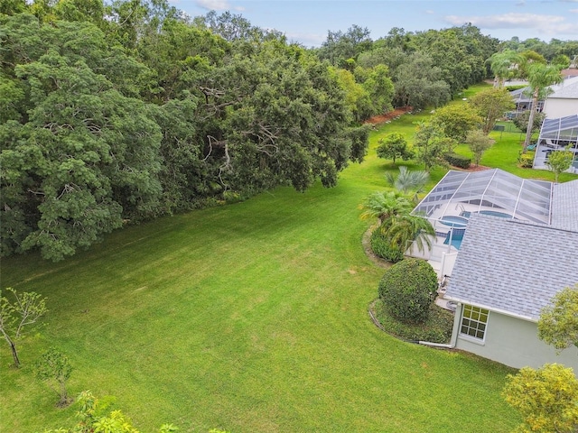 2519 Shipston Ave, New Port Richey, FL 34655 - view of grassy yard featuring a swimming pool and a lanai
