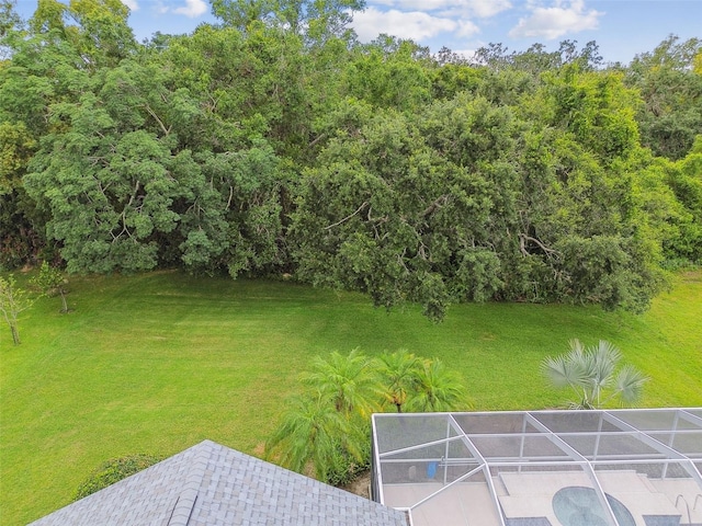 2519 Shipston Ave, New Port Richey, FL 34655 - view of green lawn with a lanai