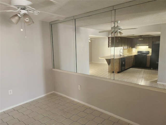 7338 Foxbloom Dr, Port Richey, FL 34668 - spare room featuring a ceiling fan, a textured ceiling, and light tile patterned floors