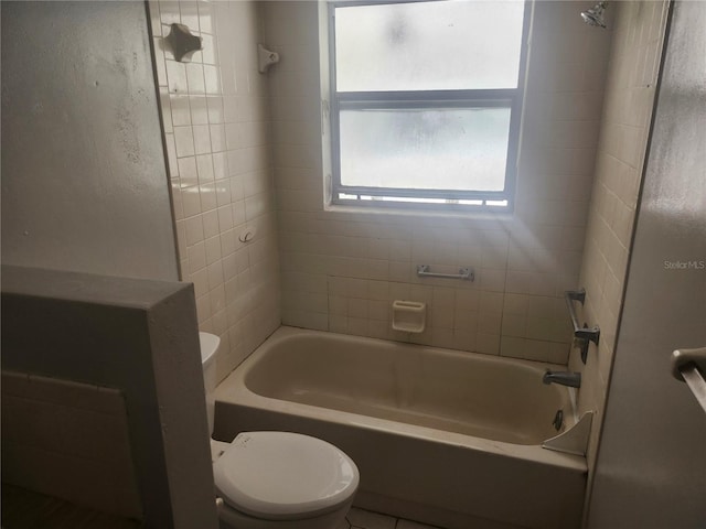 7338 Foxbloom Dr, Port Richey, FL 34668 - bathroom featuring toilet and bathing tub / shower combination