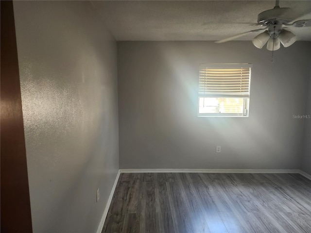 7338 Foxbloom Dr, Port Richey, FL 34668 - unfurnished room featuring dark wood-type flooring and a ceiling fan