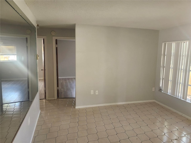 7338 Foxbloom Dr, Port Richey, FL 34668 - unfurnished room featuring a smoke detector and a textured ceiling