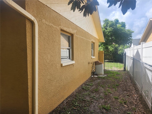 7338 Foxbloom Dr, Port Richey, FL 34668 - view of home's exterior featuring stucco siding