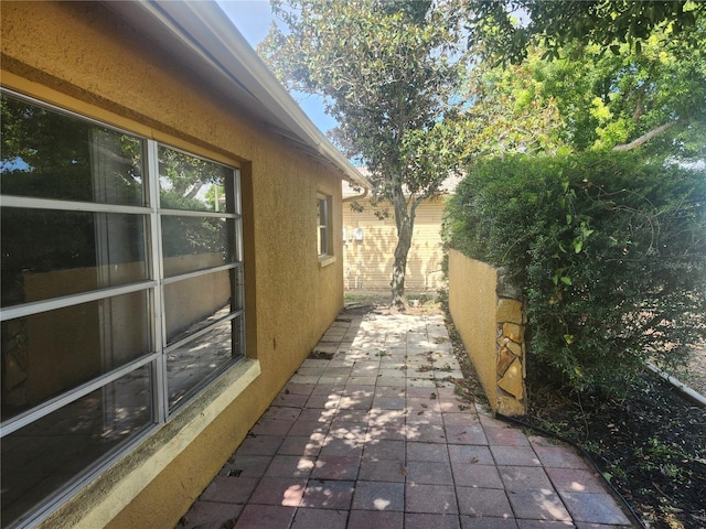 7338 Foxbloom Dr, Port Richey, FL 34668 - view of property exterior with a patio and stucco siding