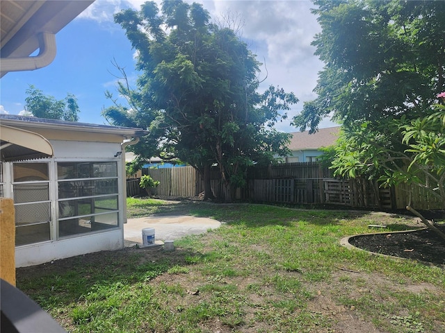 7338 Foxbloom Dr, Port Richey, FL 34668 - fenced backyard with a sunroom