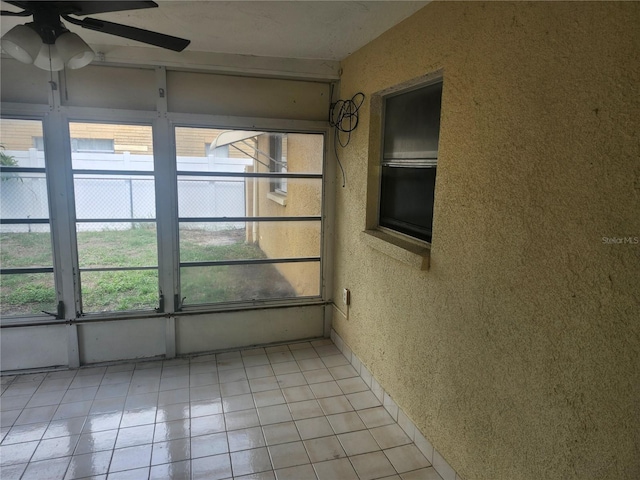 7338 Foxbloom Dr, Port Richey, FL 34668 - unfurnished sunroom featuring a ceiling fan and healthy amount of natural light