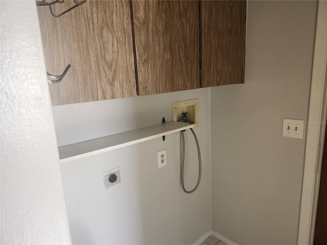7338 Foxbloom Dr, Port Richey, FL 34668 - washroom featuring cabinet space, washer hookup, and electric dryer hookup