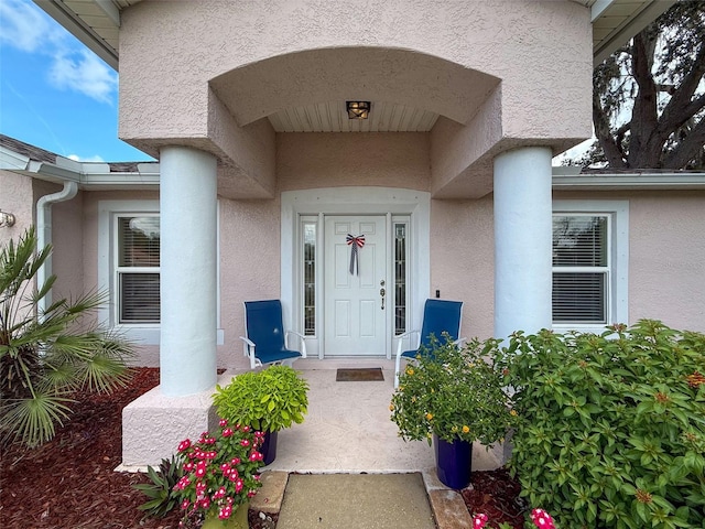 9431 Spring Hill Dr, Spring Hill, FL 34608 - doorway to property with stucco siding