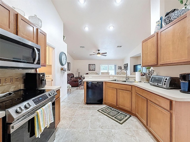 9431 Spring Hill Dr, Spring Hill, FL 34608 - kitchen featuring appliances with stainless steel finishes, a peninsula, lofted ceiling, a ceiling fan, and light countertops