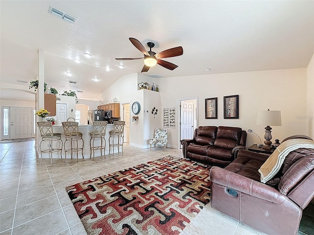 9431 Spring Hill Dr, Spring Hill, FL 34608 - living area featuring a ceiling fan, light tile patterned floors, vaulted ceiling, and arched walkways