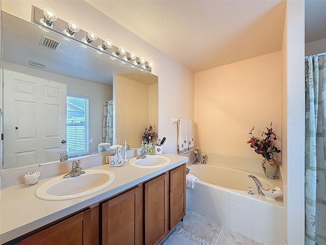 9431 Spring Hill Dr, Spring Hill, FL 34608 - bathroom featuring double vanity, a bath, tile patterned floors, a textured ceiling, and a shower with shower curtain