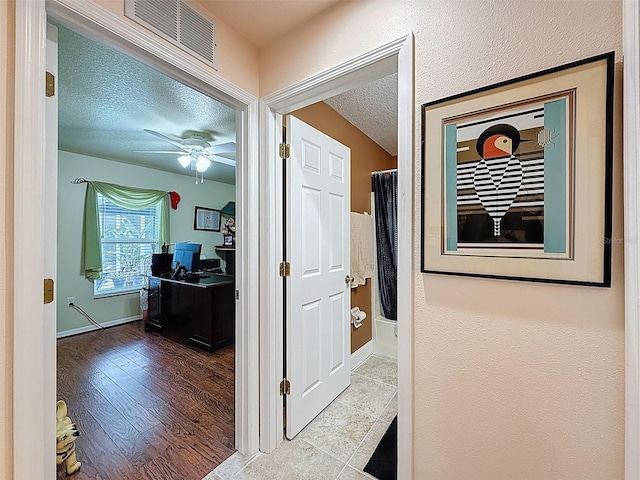 9431 Spring Hill Dr, Spring Hill, FL 34608 - corridor with an office area and a textured ceiling