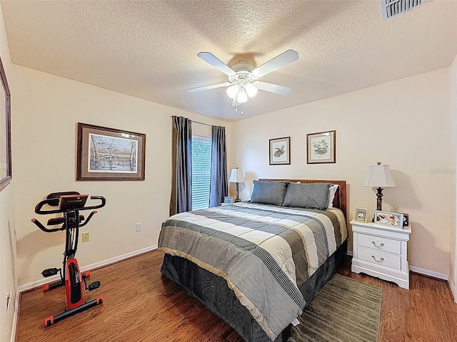9431 Spring Hill Dr, Spring Hill, FL 34608 - bedroom with wood finished floors, a textured ceiling, and ceiling fan