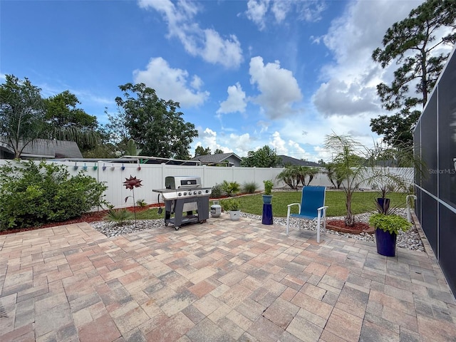 9431 Spring Hill Dr, Spring Hill, FL 34608 - fenced backyard featuring grilling area and a patio