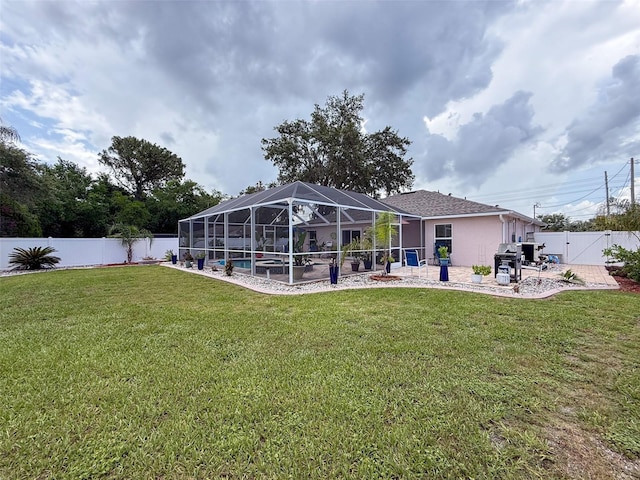 9431 Spring Hill Dr, Spring Hill, FL 34608 - rear view of property featuring a fenced backyard, a patio area, a pool, glass enclosure, and a gate