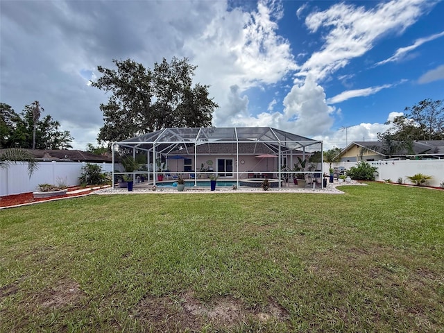 9431 Spring Hill Dr, Spring Hill, FL 34608 - back of house featuring a fenced backyard, an outdoor pool, glass enclosure, and a patio area
