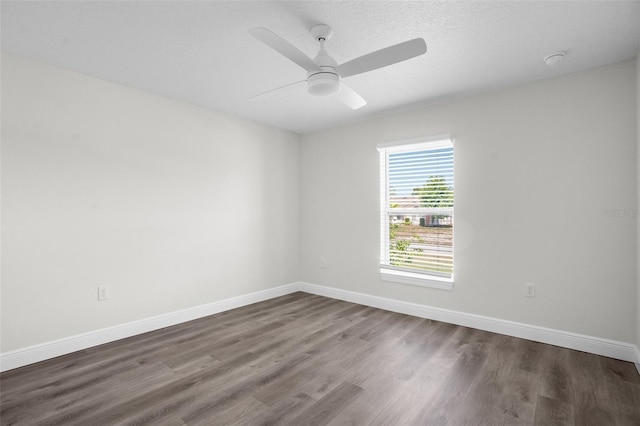 5555 Baffin Cir, Spring Hill, FL 34606 - empty room featuring wood finished floors, ceiling fan, and a smoke detector