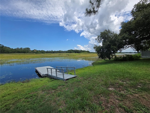 5555 Baffin Cir, Spring Hill, FL 34606 - dock area with a water view and a lawn