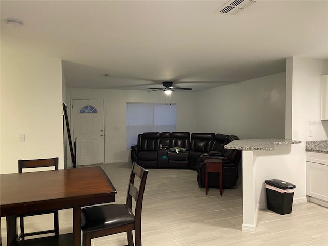 12419 Lamont Ave, New Port Richey, FL 34654 - dining room with ceiling fan and baseboards