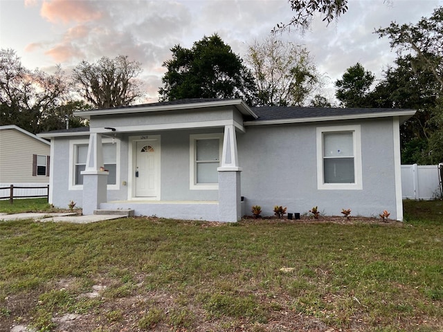 12419 Lamont Ave, New Port Richey, FL 34654 - view of front of house featuring stucco siding and a porch