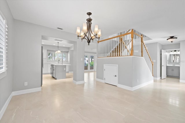 4439 Reeves Rd, New Port Richey, FL 34652 - empty room with stairway and a chandelier