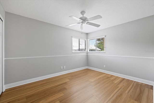 4439 Reeves Rd, New Port Richey, FL 34652 - spare room with light wood-type flooring, ceiling fan, and a textured ceiling