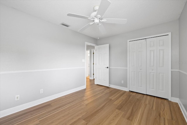 4439 Reeves Rd, New Port Richey, FL 34652 - unfurnished bedroom featuring wood finished floors, a closet, and ceiling fan